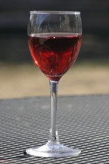 tree in a glass of cranberry juice