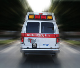 ambulance in route (fictitious business name/logo) © Stephen Coburn