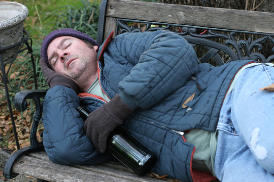 homeless man - on park bench