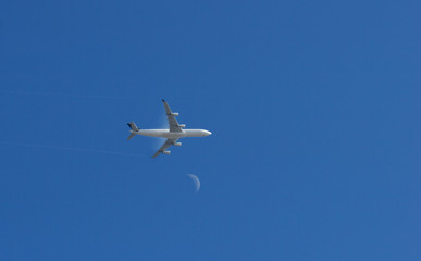 jet over moon