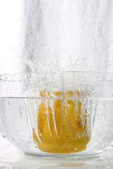 juicy citron splashing into water