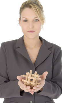 beautiful blonde business woman with wooden puzzle