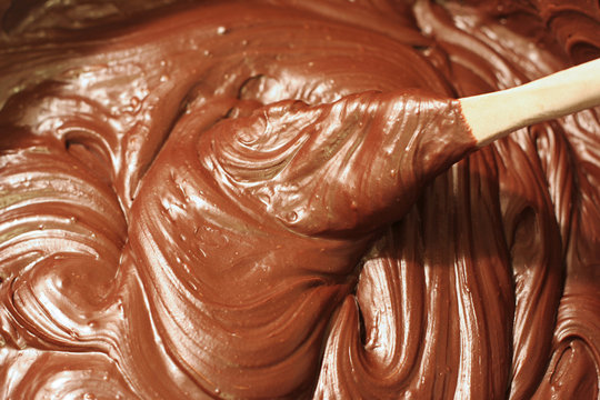 stirring chocolate fudge