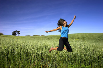 jumping on a green field