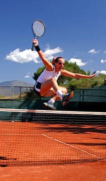 girl jumping tennis net