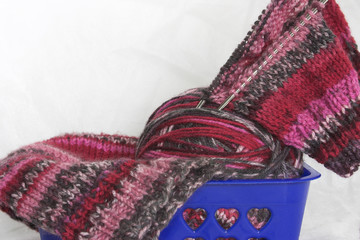 clew and knitting needles.