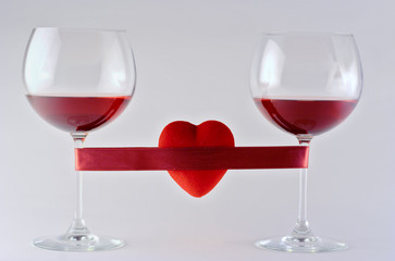 two wine glasses wrapped with tape and heart