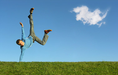 man on hand on blue sky with cloud