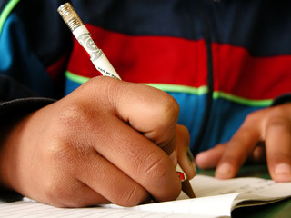 schoolboy holding a pencil