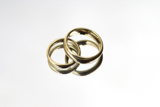 wedding rings on a mirror