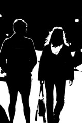 silhouette of people walking together