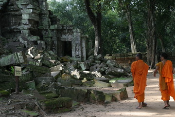monks walk through temple
