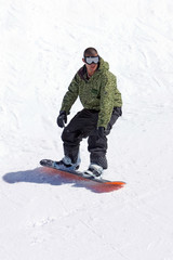 snowboarder on half pipe of ski resort in spain