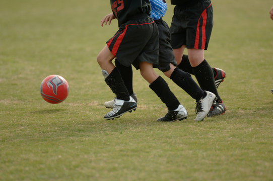 kids playing soccer - football