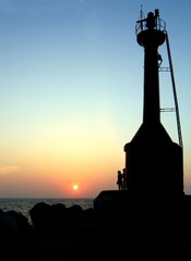 signal tower and ocean sunset