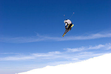 man skiing on slopes of ski resort in spain