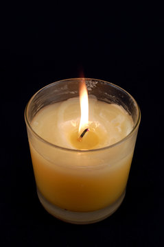 candle against black background