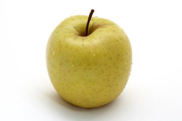 yellow apple with drops