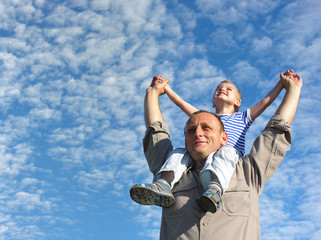 grandfather with grandson under cloudfield