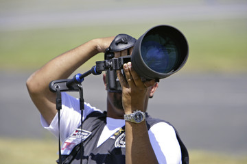 photographer with zoom lens
