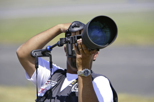 Fototapeta photographer with zoom lens