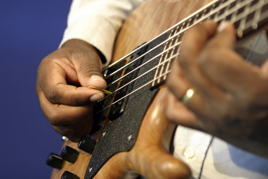 man playing guitar fingering