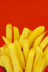 Fototapeta na wymiar french fries on red