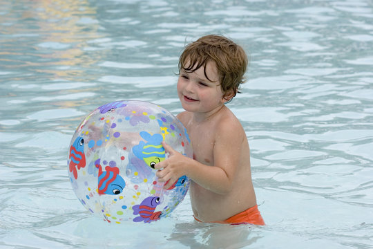 boy playing with beach ball