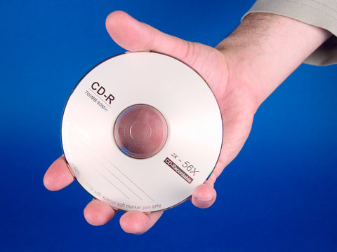 hand holding a cd