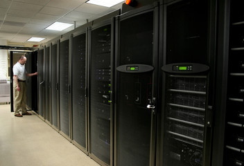 technician working on racks of 1u and 2u servers
