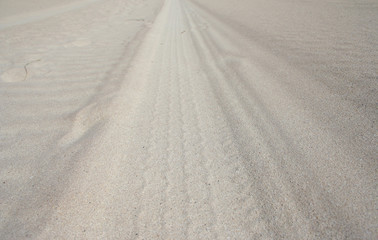 tyre track across sand