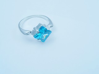 blue soft background with  sapphire ring