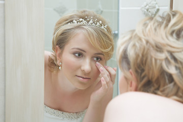 bride looking in a mirror