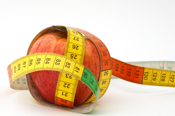 red apple with tape to measure