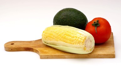 a corn, avocado, tomato