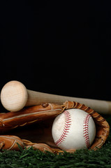 baseball and bat on black