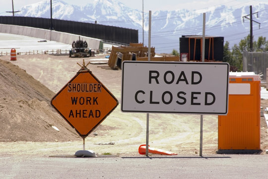construction site and road closed sign