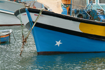 Fototapeta na wymiar boats of fish in harbor