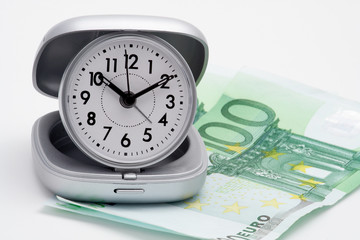 clock and money (euros)