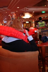 Obraz na płótnie Canvas woman during safety drill on cruiseship