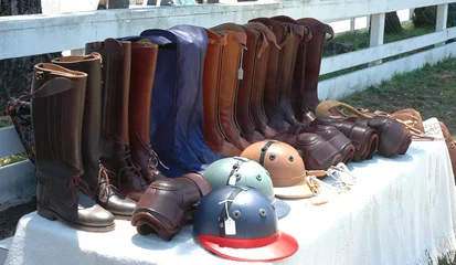 Afwasbaar Fotobehang Paardrijden polo riding boots & helmets