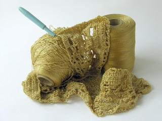Fototapeta na wymiar yellow cotton thread,crochet and serviette