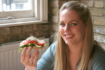 blond woman with healthy salad meal