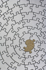 silver jigsaw with one missing piece