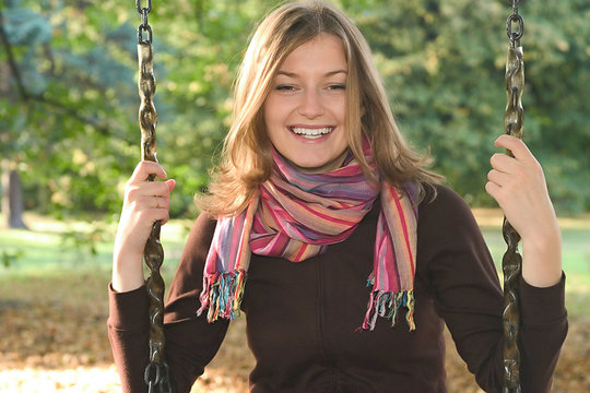 Young Woman On A Swing