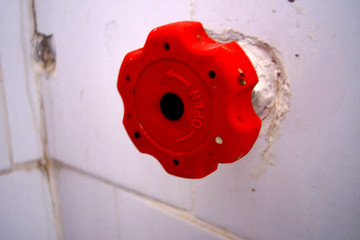 red bathroom valve