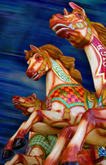 three horses of a carousel