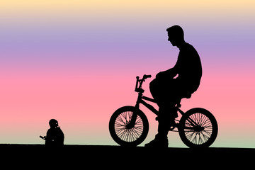 Obraz na płótnie Canvas Młody rowerzysta, sylwetka