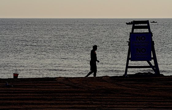lonely man and lifeguard tower