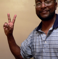 african american man   gesturing a peace sign